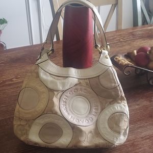 Cream colored Coach Purse